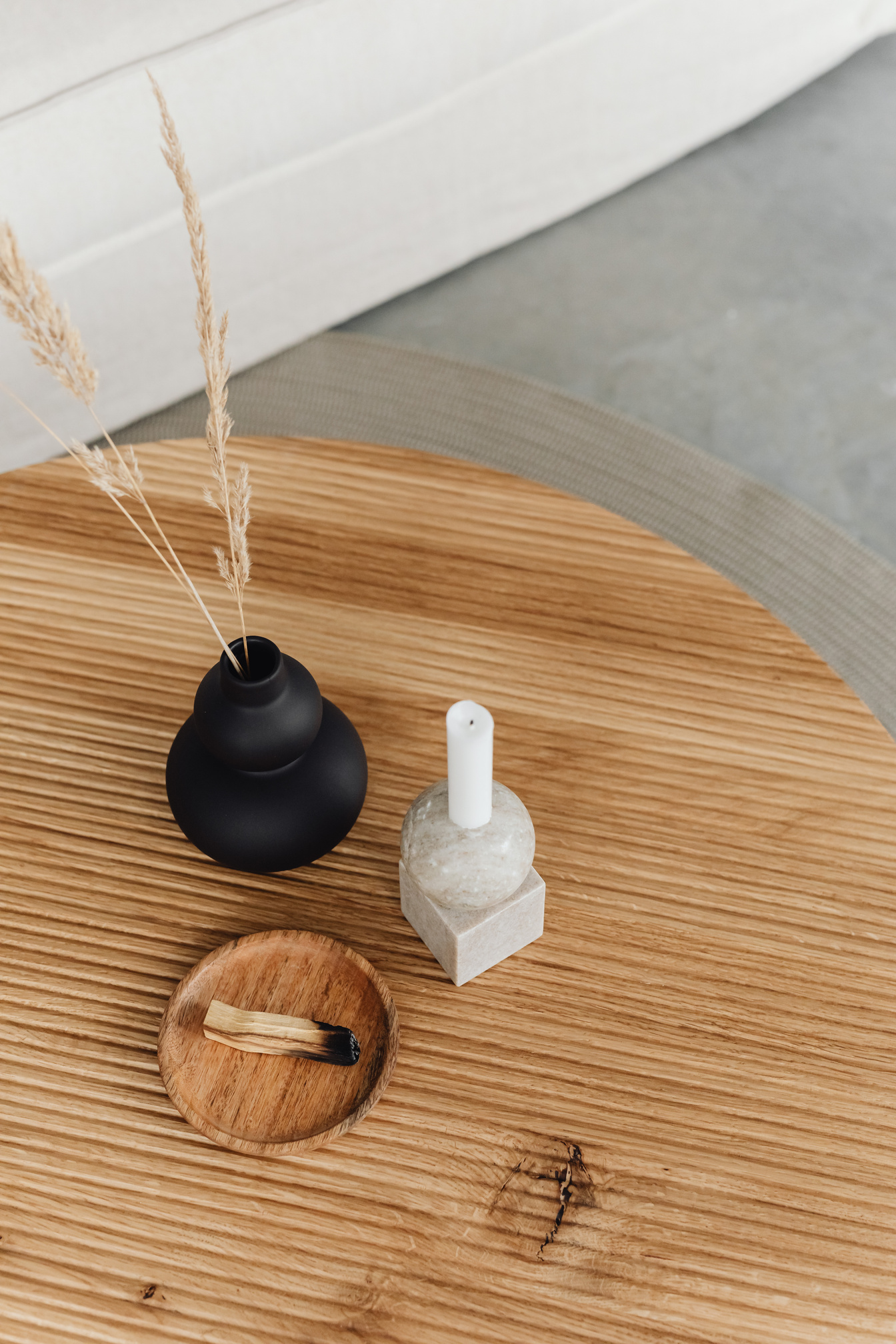 Candle and Grain Ears in Black Vase on Table